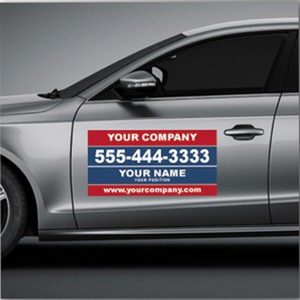 Gray car with magnetic sign on driver door. Sign is red and blue with text containing a phone number