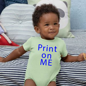 Baby in onsie that says print on me.